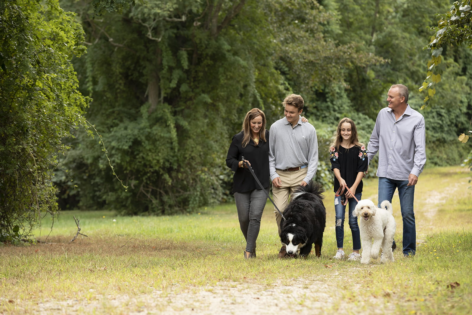 Logan and his family walking their dogs