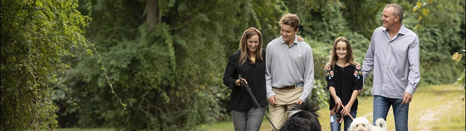 Logan and his family walking their dogs